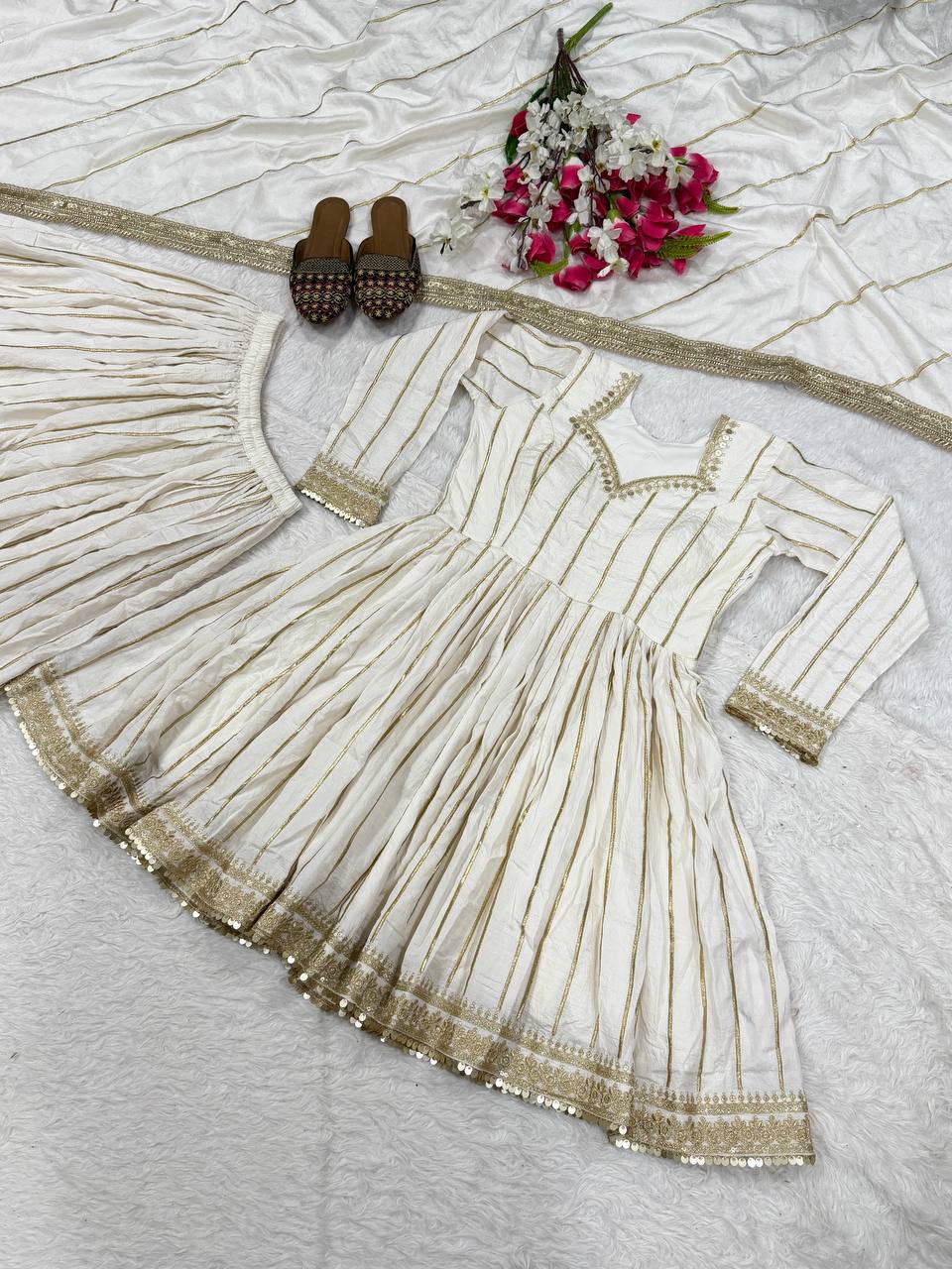 Radiant Rose Pink Flared Peplum Kurti and Sharara Set Embellished with Luminous Gold Zari Stripes and Sequined Borders